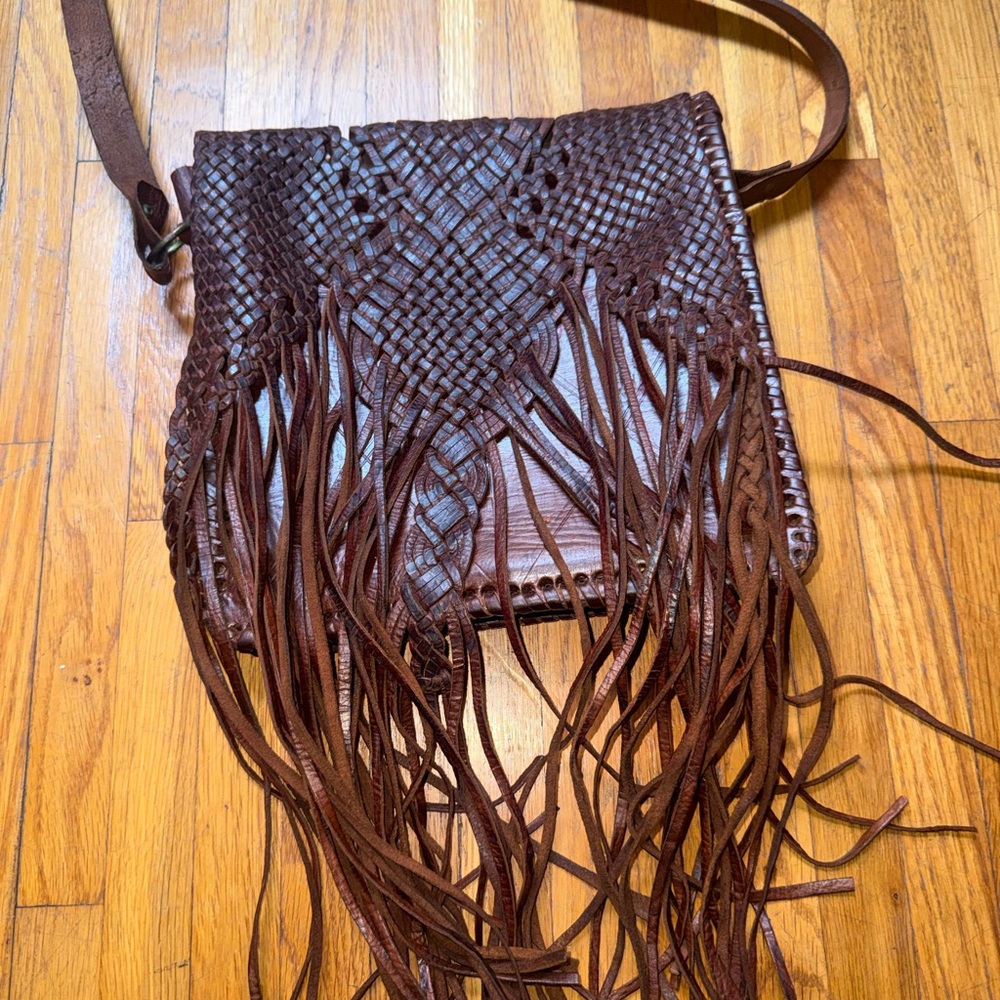 Handmade brown leather fringe purse